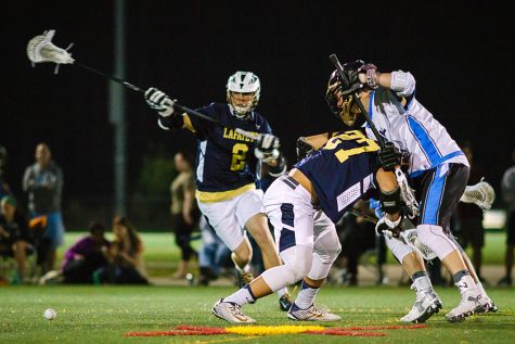 Tristen Packer wins a face-off against Warhill in early-season play.