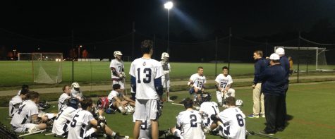 Coach Thomas Rice speaks to the new Lafayette Lacrosse team at halftime of the Jamestown match.
