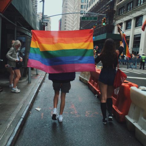 Activist parade down the street at a lgbtq pride rally