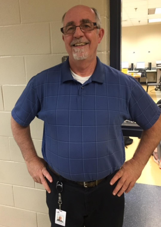 Mr. Rountree brightly smiles for the camera.