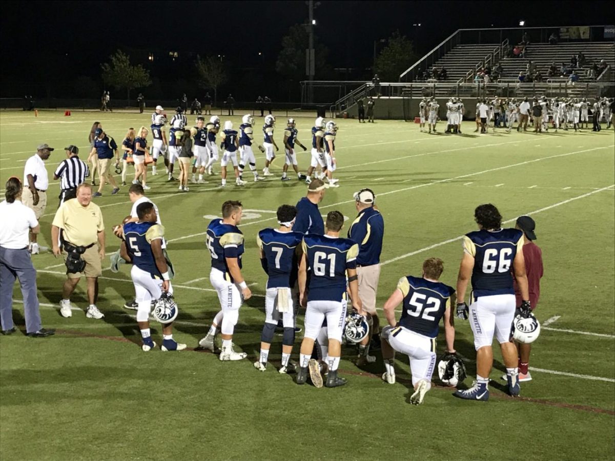 On Thursday night at Wanner Stadium, Coach Linn and Coach Sorrell talk with their offensive starters. The Rams leaped out to a 28-0 lead in the first quarter. Jordan Ballowe (8) and Vashod Phillips (3) combined for 6 touchdowns in the first half alone.