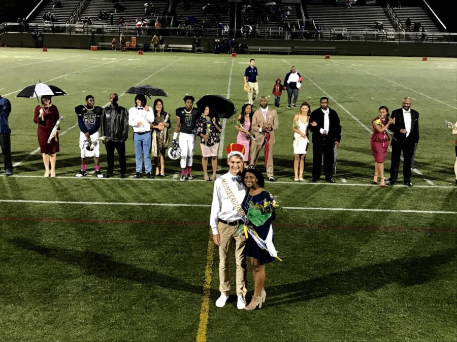 Chris Collins and Maya Canaday pose during halftime of the Homecoming football game, just after being crowned Homecoming King and Queen.