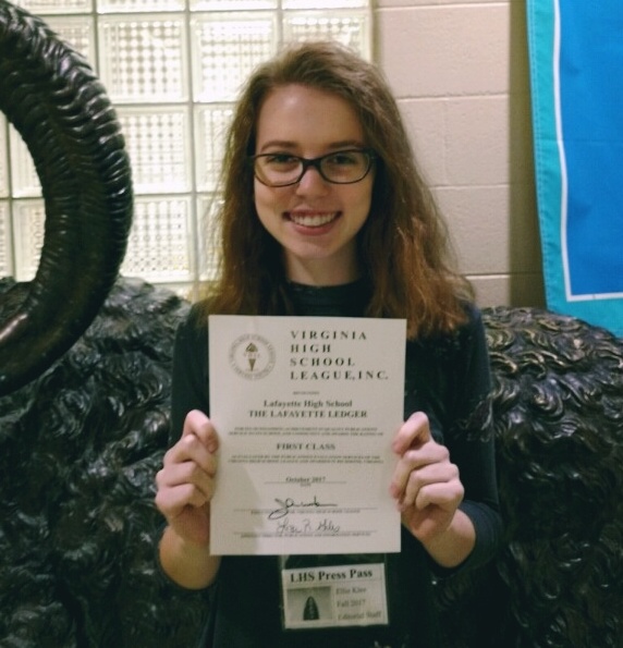 Op-Ed editor Ellie Klee shows off the Ledgers First Class award.