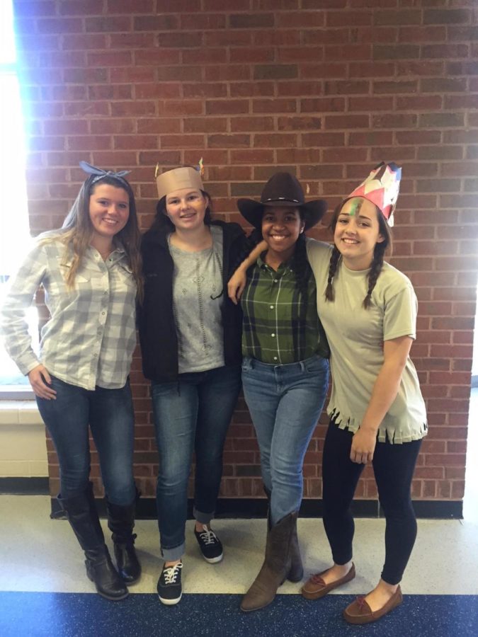 In the spirit of the Wild West, my friends and I smile together to prove that Native Americans and Cowboys can get along. This was my favorite day because I love the time period of the Wild West. The comment I hear throughout the day is, You look like a Native American cowboy.
