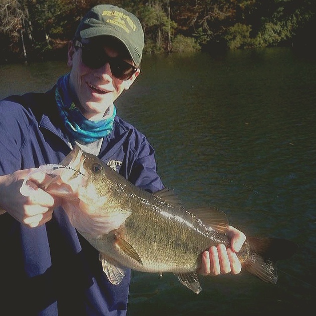 Flynn Crisci is ecstatic after he catches a 7 pound 3 ounce Largemouth Bass, during the Fall of 2017 on a local Willaimsburg pond.