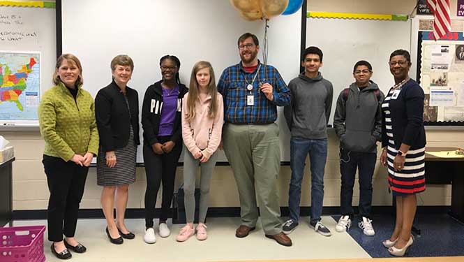 Mr. Legawiec poses with the superintendent of WJCC and interim Principal of Lafayette Highschool, Dr. Kimberly Hollemon. (Pictured from left to right: Kyra Cook, Olwen Herron, Neviah Johnson, Katie Johnson,  Stephen Legawiec, Avery Johnson, Darius Johnson, Kimberly Hollemon)