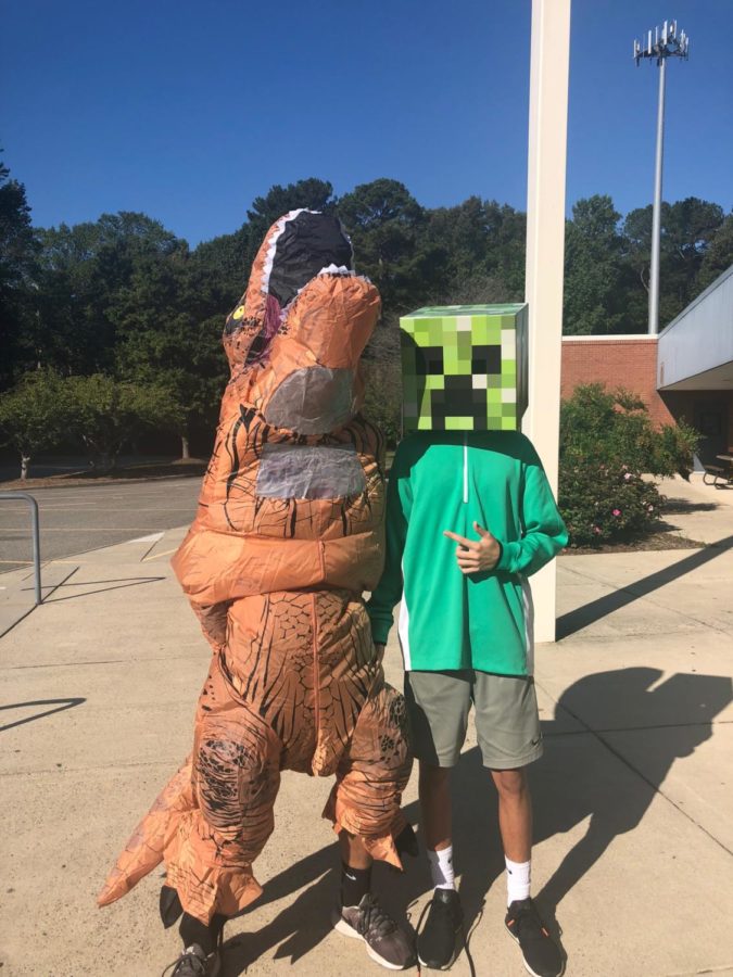Dylan in the scary Creeper next to drew in the ferocious dinosaur dressed up accordingly for wildlife Wednesday.