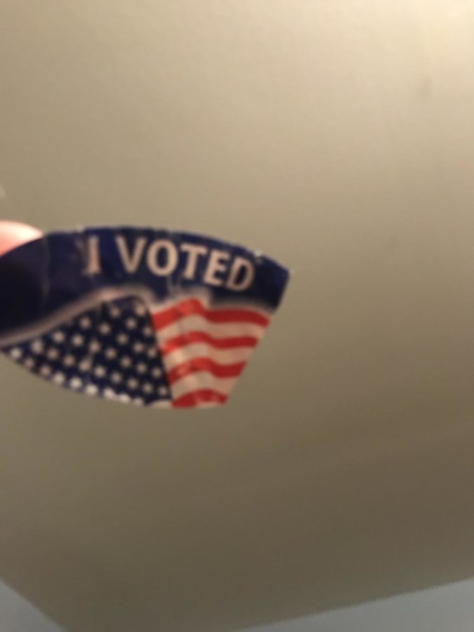 After voting, people receive a sticker to wear.