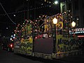 To help celebrate Carnival, parade floats are used during street parades. People will often decorate these floats with bright colors, beads, feathers, and designs. Lights are seen illuminated on the float to light up the event at night.