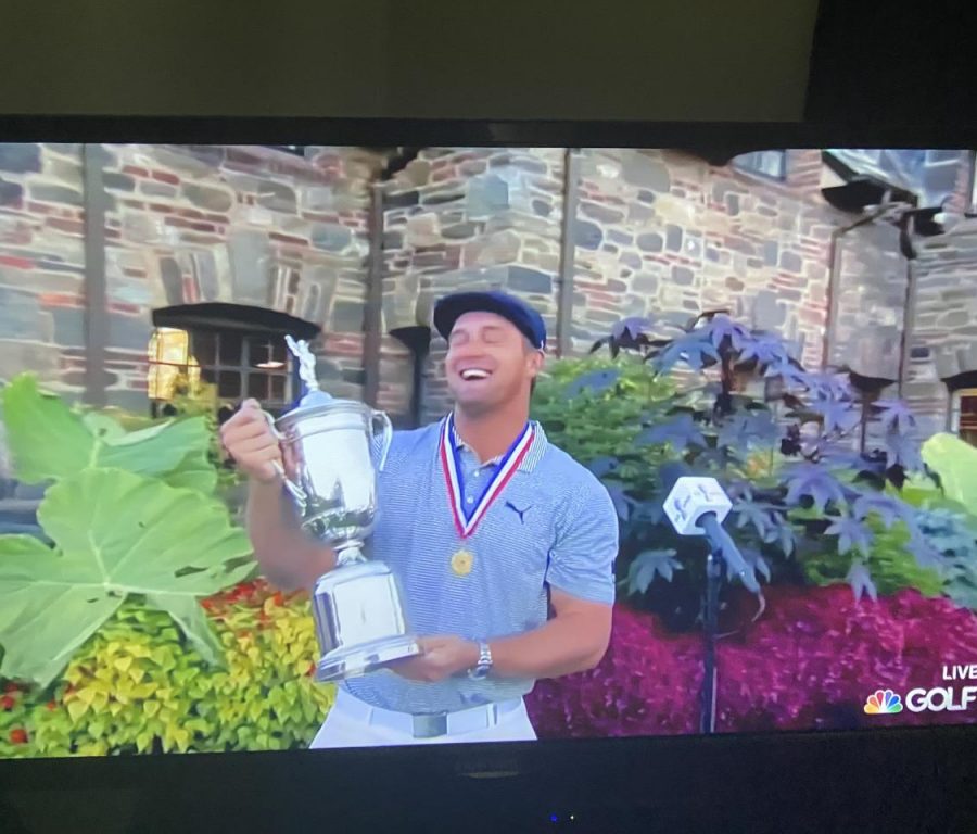 Bryson holding the US Open trophy