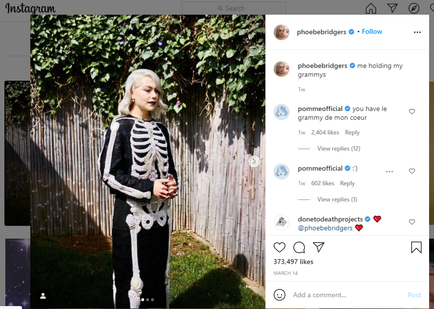 Phoebe Bridgers, a 4-time nominee this year, poses for a picture in a skeleton dress before the Grammy Awards. 