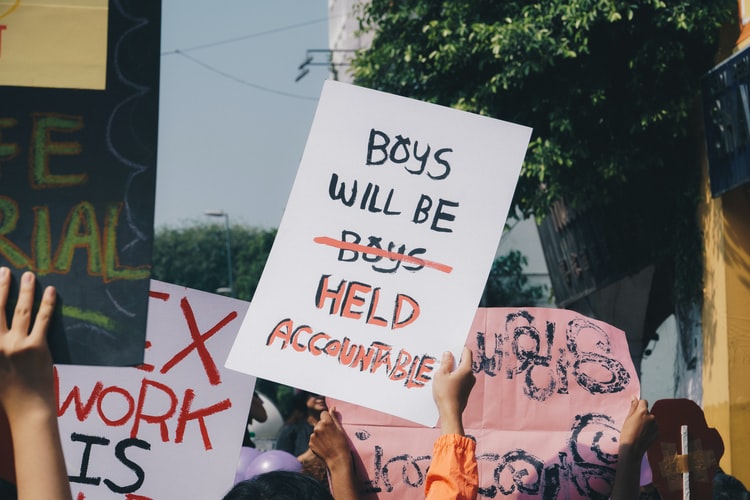 More times than not, when women come forward about their experiences with sexual assault, they are met with the phrases, Boys will be boys or You should have protected yourself better. This sign shows that women are tired of hearing those words and instead want those who are guilty of sexual assault to be held accountable and for boys to be educated.