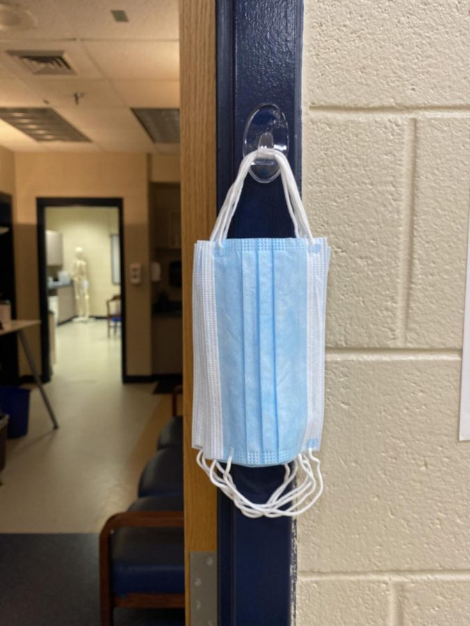 Masks hang outside of the nurses office so students that are unable to bring one to school or incase students need a new one.