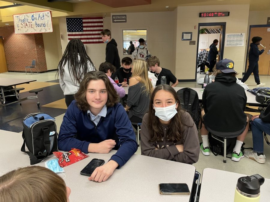 Brooke Potter and Jack Smith are showing the right to optional masks. Brooke has decided to keep wearing her masks even at lunch, while Jack has decided to take his off. 
