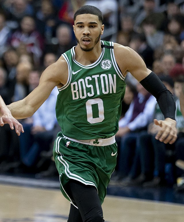 Jayson Tatum, who has very nice hair, running down the court before they lose Game 1 versus the Miami Heat