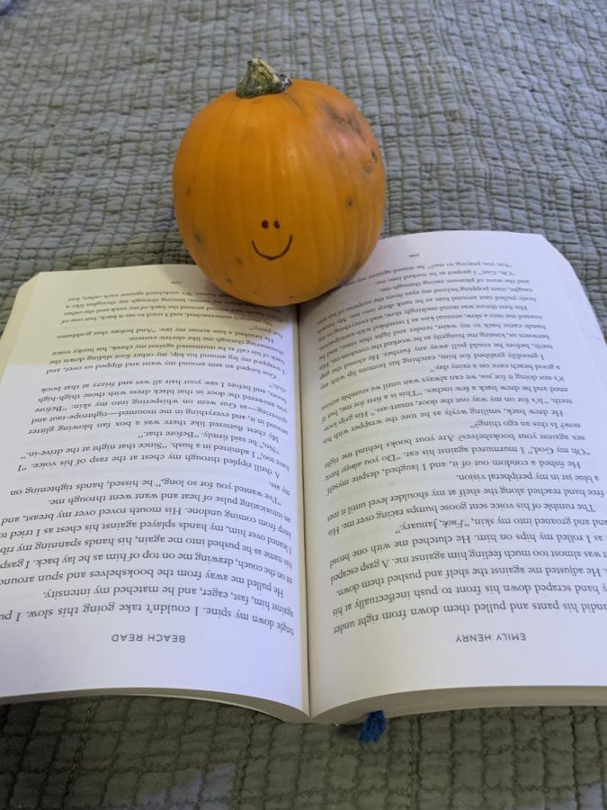 Rarely seen reading, The pumpkin tries to finish a lovely book. As fall approaches the pumpkin continues to stay inside, as it is getting colder.