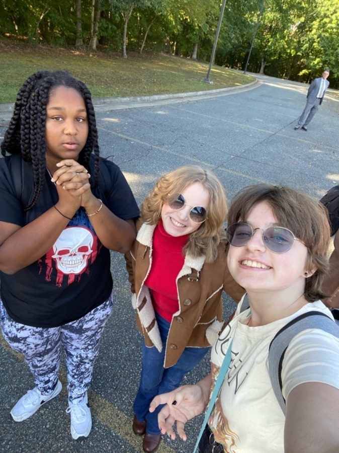 A trio of students show their support by joining the walkout on September 27, an event created to protect trans and queer students’ rights in school.