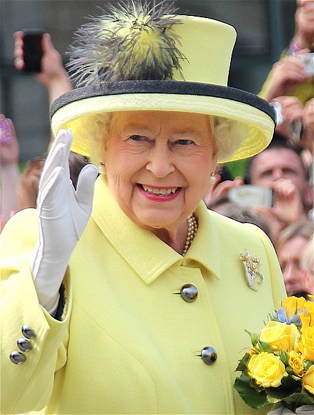 The Queen was known for her colorful outfits that she wore. The Queen would always have a hat that corresponded with her outfit. Personally, I think that this was one of her best outfits.