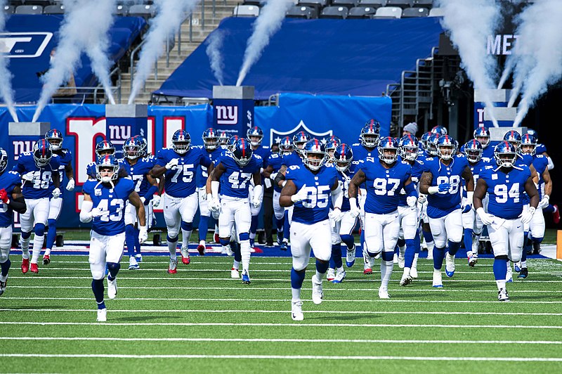 Giants Team Runs onto the field as they are ready to dominate their oppenents
