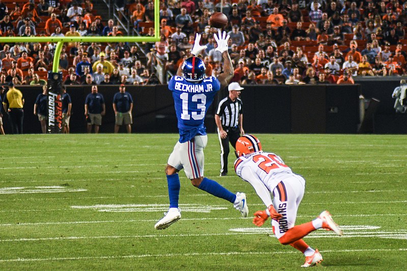 OBJ makes a jumping grab for the New York Giants before defending Browns corner makes his hit.