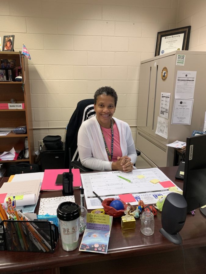 Dr. Scott pictured here in her organized office, which showcases how she is!