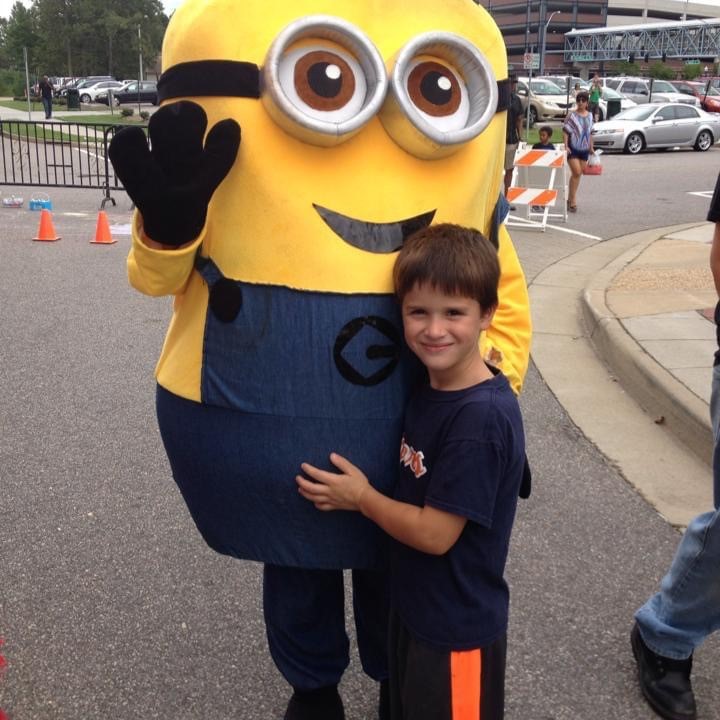 Kyle Kremer is hugging his favorite minion, Bob; he is seen having an amazing time next to Bob. Kyle was surprised with a trip Universal Studios with his family by his parents, he spent several days there and had a time of his life. This photo was taken by Mrs. Kremer