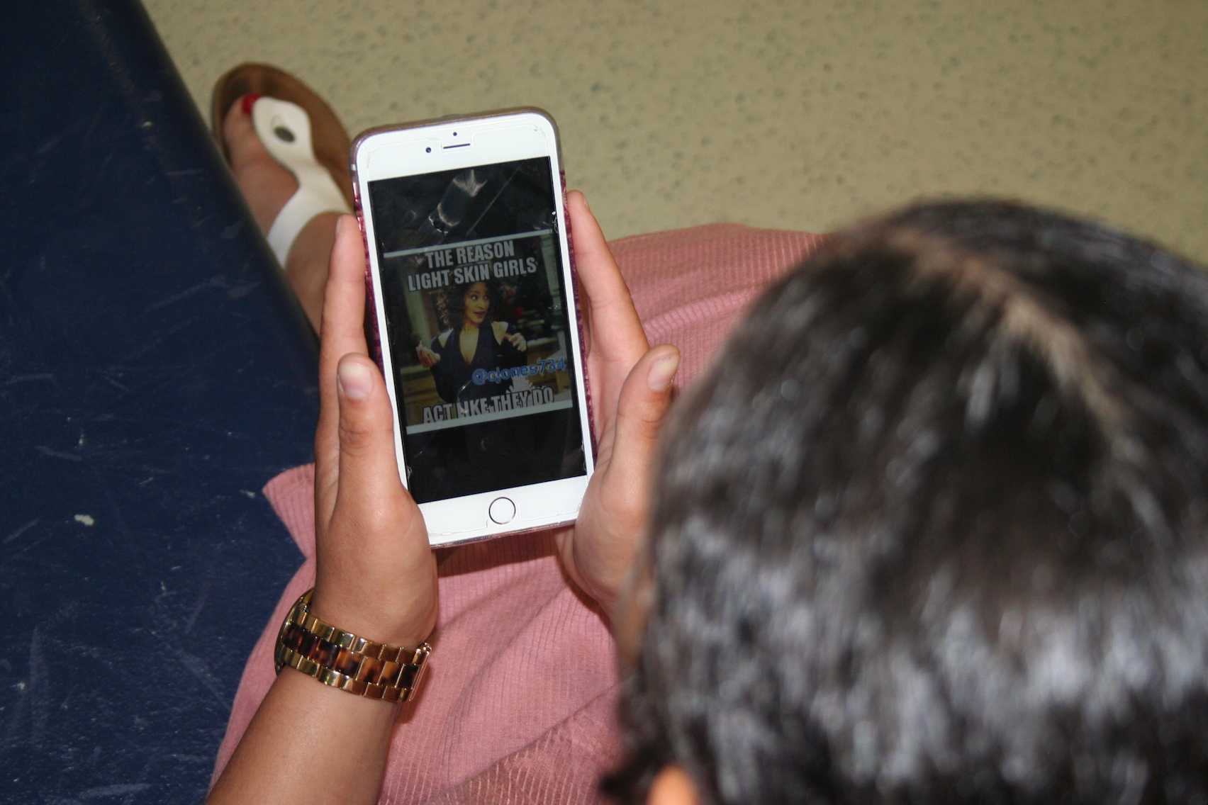 Destyni Kuhns-Gray looks at offensive photo depicting light skin girls