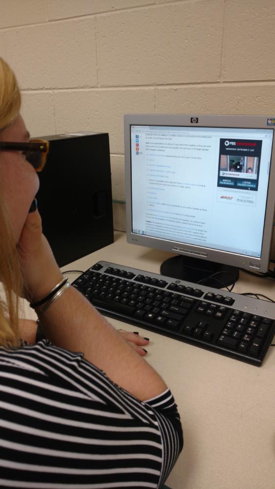 A student looking at relief organizations to help hurricane victims in Puerto Rico