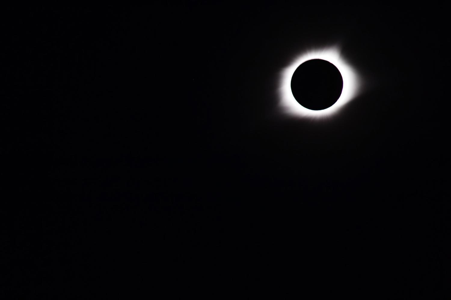 Total Eclipse 8/21/17.  People were able to remove their eclipse glasses. This picture was taken with the solar filter, which made normal light impossible to see.  Being able to see the outer rays of the sun with a filter shows how bright the sun is, regardless of an eclipse.