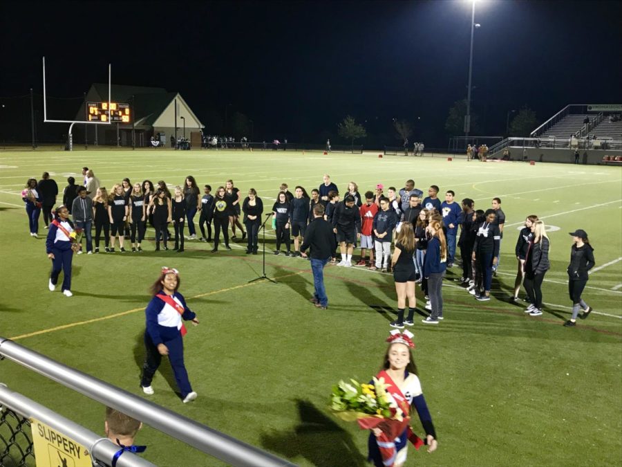 The Lafayette Choir prepares to perform before Friday night's matchup. Much to the annoyance of Lafayette's fans, the Jamestown student section attempted to add their voices in song.