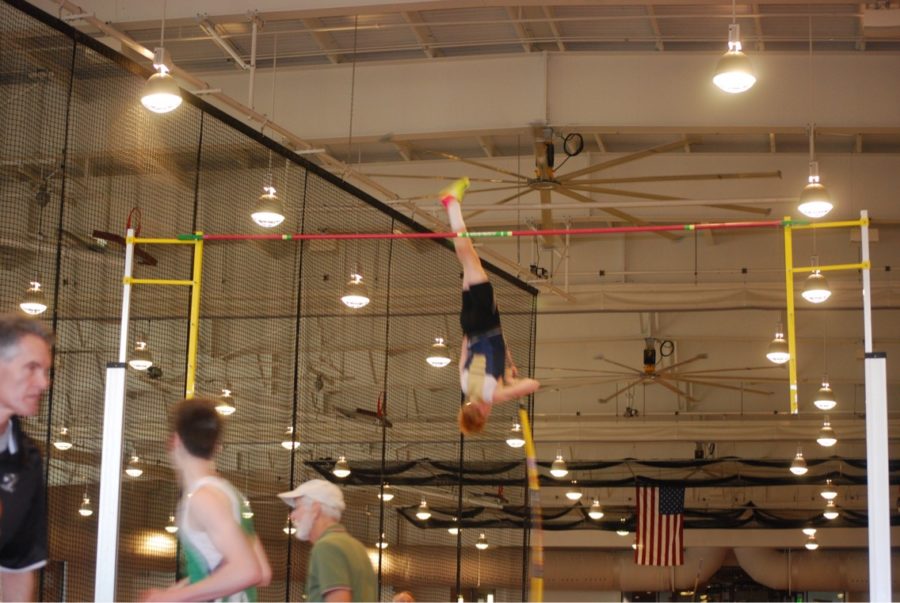 Sophomore Braden Underwood goes up and over the bar for pole vault. Braden was very excited to compete at the state level. 