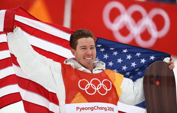 Shaun White filled with emotion as he represents America on the gold medalist stand.