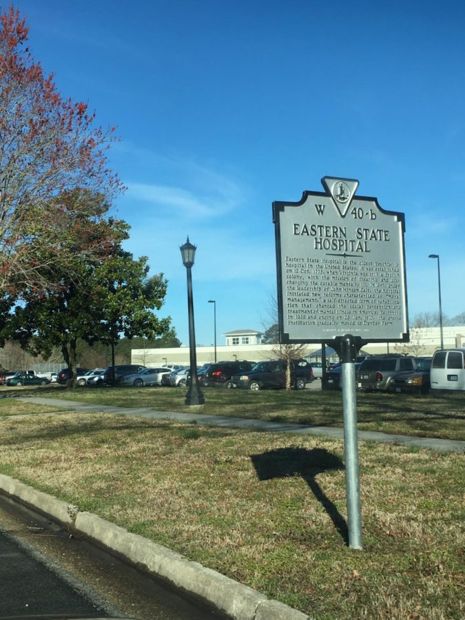 A small yet informing sign gives visitors a brief history of the mental institution.