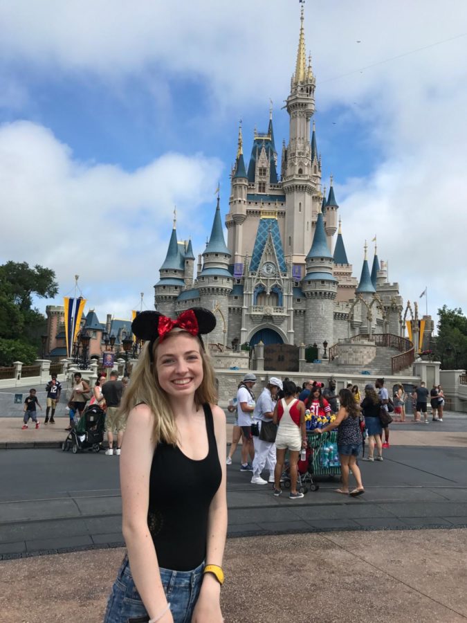 Jessica smiles in her happy place which happens to be the happiest place on Earth.