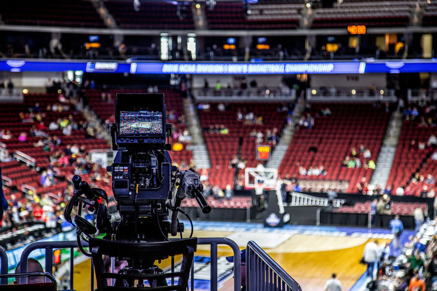 Cameras are rolling on the court as the Madness kicked off with the Kansas Jayhawks were practicing for the tournament at the Wells Fargo Arena. 