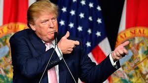 President Trump is acting as if he is holding an assault rifle, in the days following the most recent mass shooting.  His position on gun control has been very inconsistent over time.