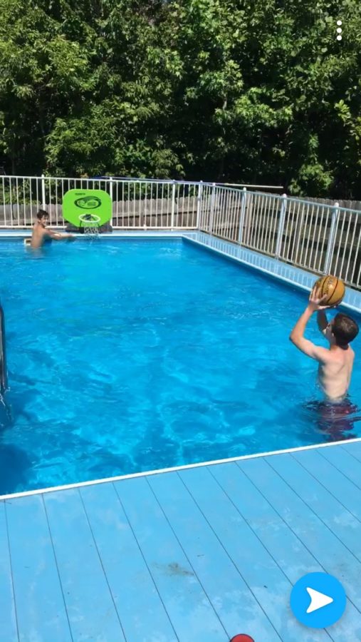 Alaina McKnight and her family enjoying the warm summer sun by their pool