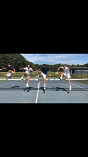 Rarely seen in tennis, the four jump over the net with ease.