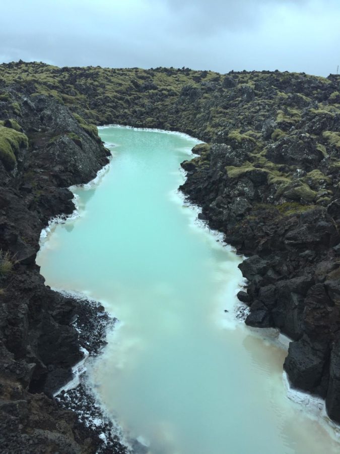 Running through the dark rocks of Ireland is a blue stream from the Blue Lagoon.