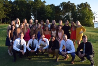 Seniors take pictures at Two Rivers Country Club before the dance. 