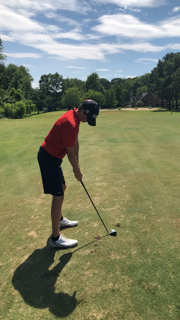 Christian Hankins perfects his swing at the golf course in Ford Colony.