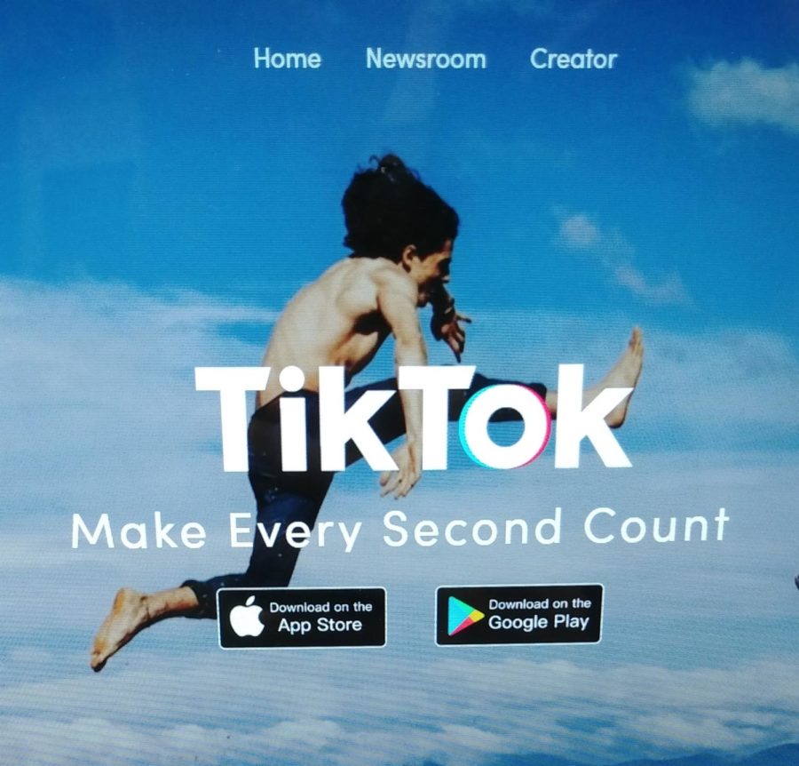 Tik Tok's main page displays their motto and ways to download the app.