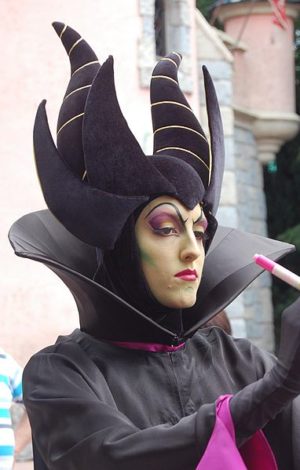 A young lady dresses up as Maleficent at Disney World.