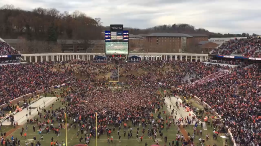 Virginia fans rush the Scott Stadium field after a 15 year drought against Virginia Tech.