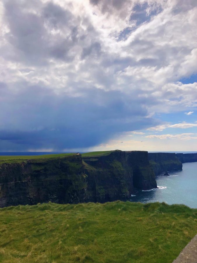 The bag pipes softly played in the background as we watched the waves crash against the Cliffs of Moher.