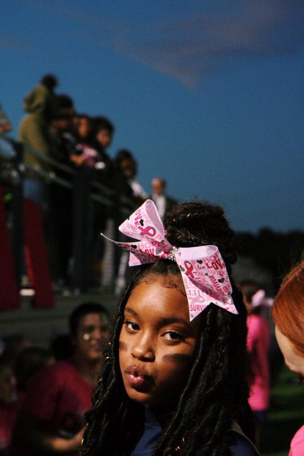 Asante Marrow posed for a quick picture while cheering on the sideline for her football team. 