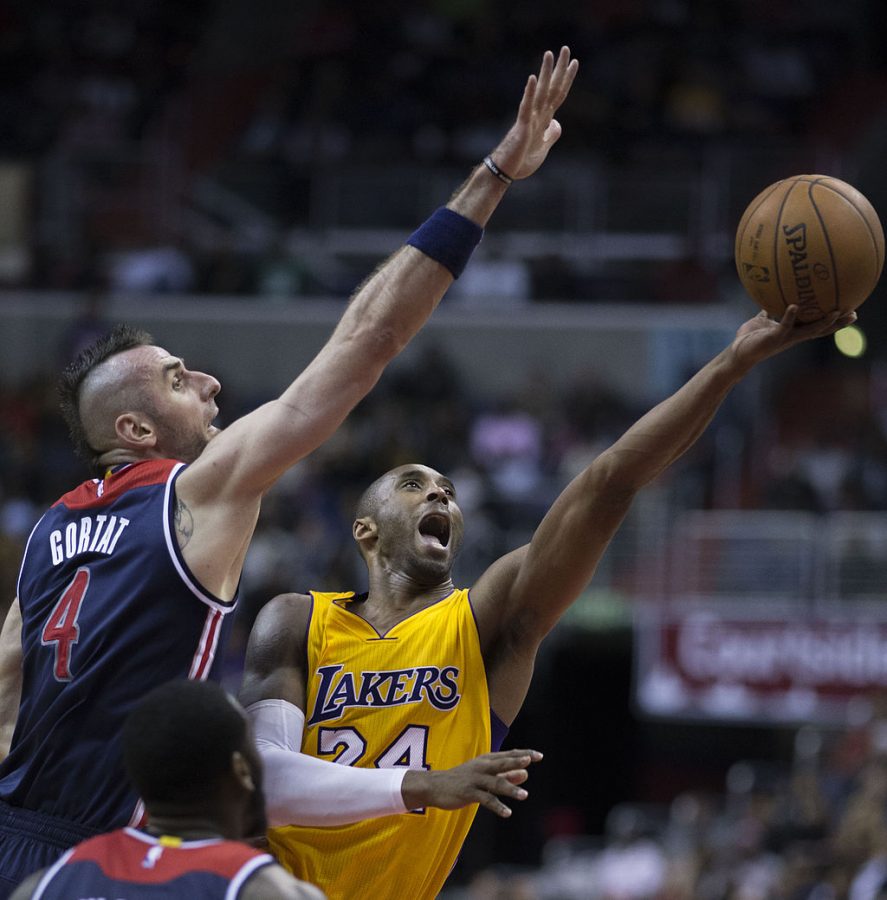 Kobe Bryant with the LAkers shooting aganist Marcin Fortat at the Washington Wizards game