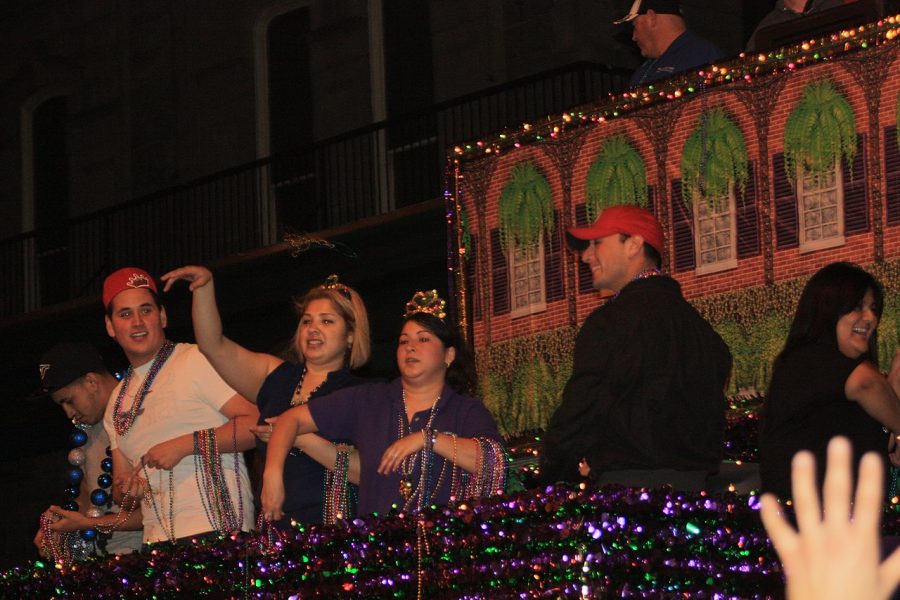 People on a float during Mardi Gras in Texas immitating the traditions in New Orleans, Louisiana.