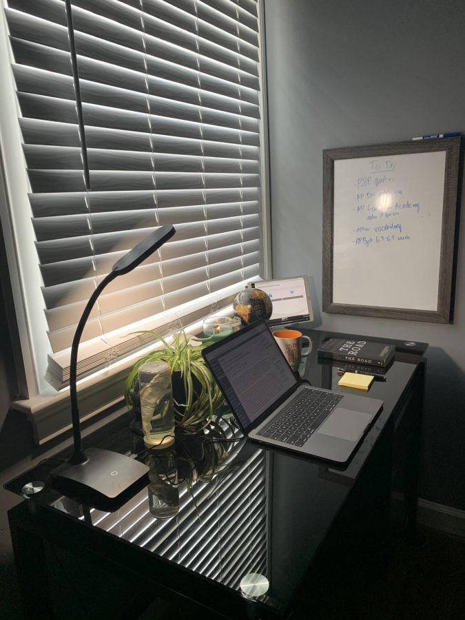 While leaning on my bed in my pajamas, I am able to take a picture of my entire work space for the next five hours. Behind my dry erase board, I can hear my sister's ongoing zoom call. 