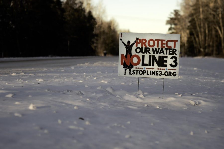 "Protect our water" declares a sign stuck in the thick Minnesota snow. 